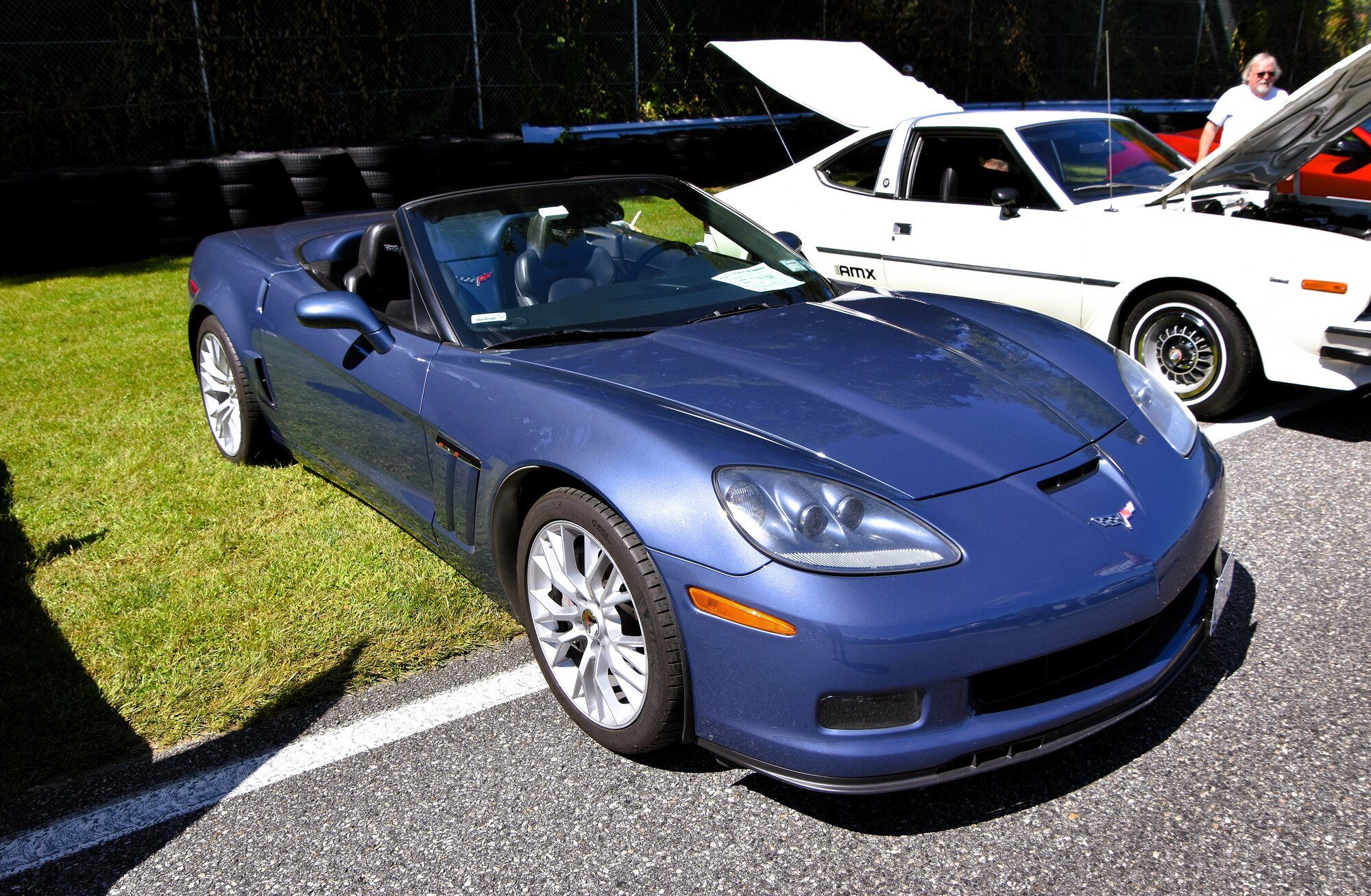 Blue 2012 Chevrolet Corvette C6 Grand Sport convertible, front three-quarter view, top down